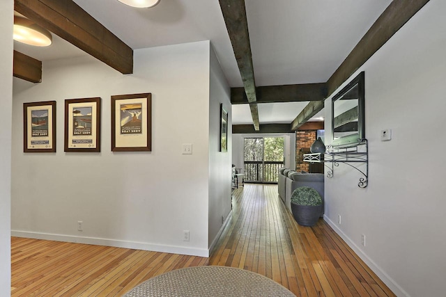 940 Alpine Dr Unit 01, Fontana, WI 53125 - hallway with beam ceiling, hardwood / wood-style floors, and baseboards