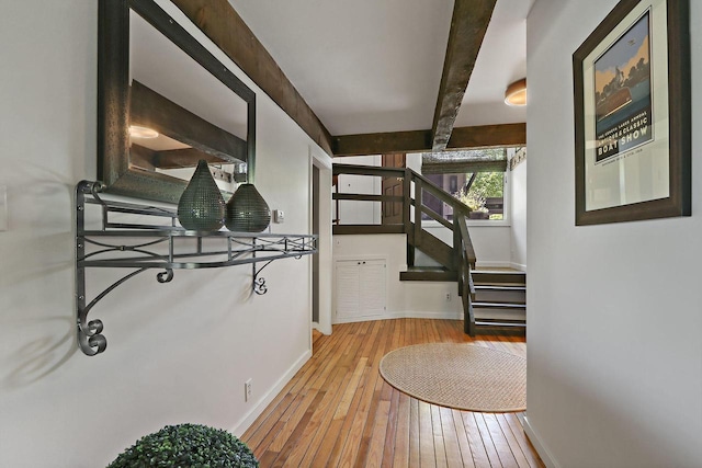 940 Alpine Dr Unit 01, Fontana, WI 53125 - hallway featuring light wood-style flooring, baseboards, and stairs
