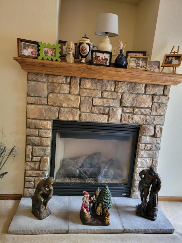 2832 E Somers Ct, Cudahy, WI 53110 - detailed view of a fireplace, carpet flooring, and baseboards