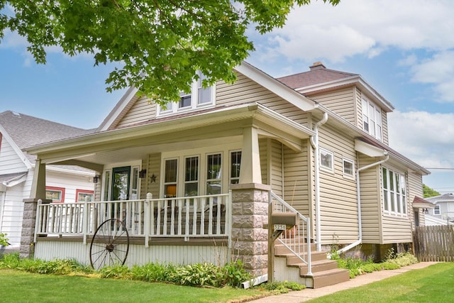 3256 S 10th St, Milwaukee, WI 53215 - view of front of house featuring a porch and a shingled roof