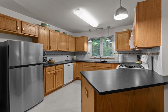 91 Potawatomi Rd Unit N-2, Williams Bay, WI 53191 - kitchen with freestanding refrigerator, dishwasher, range, a sink, and dark countertops