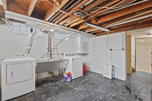 3612 N 57th St, Milwaukee, WI 53216 - washroom with washer and clothes dryer and dark floors