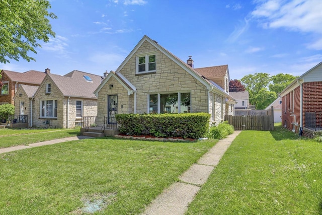 3612 N 57th St, Milwaukee, WI 53216 - view of front of house with stone siding, a chimney, and roof with shingles