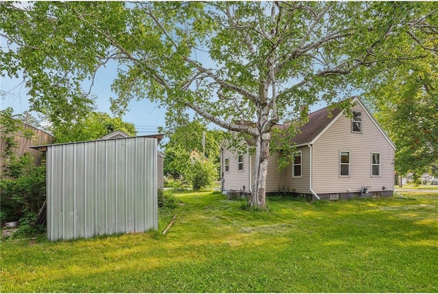 201 5th St, Centuria, WI 54824 - view of home's exterior with a yard