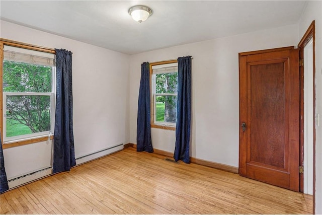 201 5th St, Centuria, WI 54824 - unfurnished room featuring light wood-type flooring and baseboards