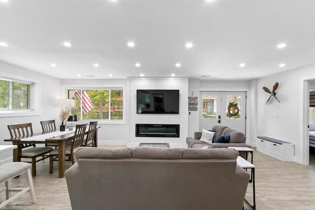 539 Highland Rd, Williams Bay, WI 53191 - living room featuring a fireplace, light wood finished floors, baseboards, and recessed lighting