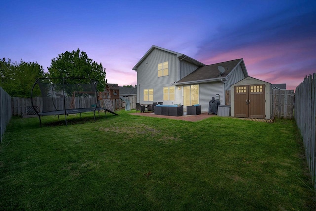 2759 Hamilton St, Oshkosh, WI 54901 - back of house with outdoor lounge area, a trampoline, and a patio area