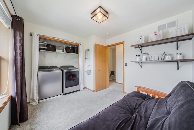 2759 Hamilton St, Oshkosh, WI 54901 - laundry area with carpet, washing machine and clothes dryer, and baseboards