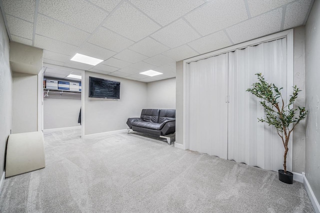 2759 Hamilton St, Oshkosh, WI 54901 - living area featuring carpet floors, a paneled ceiling, and baseboards