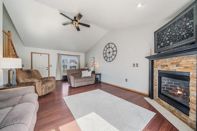 2759 Hamilton St, Oshkosh, WI 54901 - living room with ceiling fan, a fireplace, lofted ceiling, wood finished floors, and baseboards