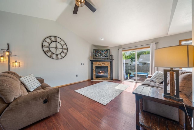2759 Hamilton St, Oshkosh, WI 54901 - living room featuring lofted ceiling, a ceiling fan, a stone fireplace, wood finished floors, and baseboards