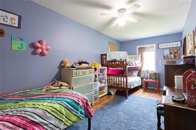 1843 190th St, Centuria, WI 54824 - bedroom with wood finished floors and a textured ceiling