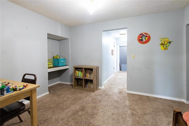 1843 190th St, Centuria, WI 54824 - game room with carpet, a textured ceiling, and baseboards
