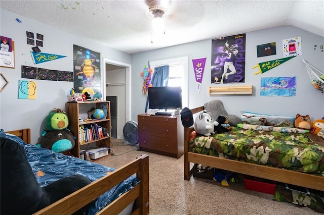 1843 190th St, Centuria, WI 54824 - bedroom with a textured ceiling, a ceiling fan, and lofted ceiling