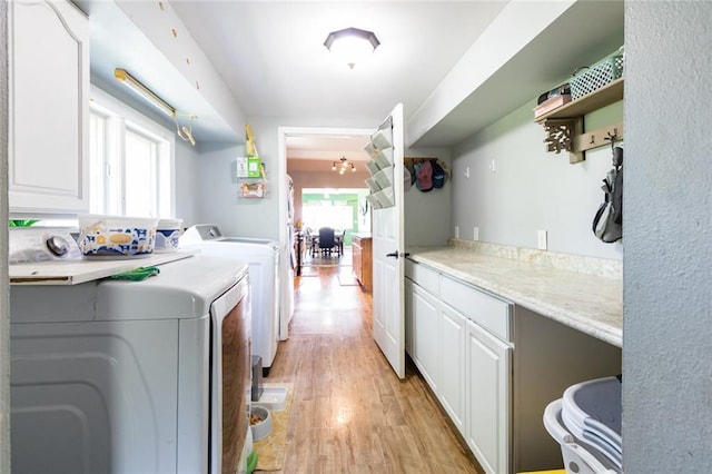 1843 190th St, Centuria, WI 54824 - laundry room with cabinet space, independent washer and dryer, and light wood-type flooring