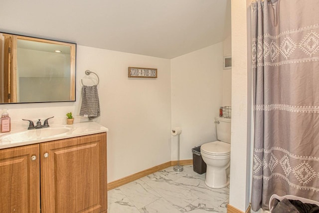 811 E Maple St, Lancaster, WI 53813 - full bath featuring marble look tiles, vanity, toilet, and baseboards