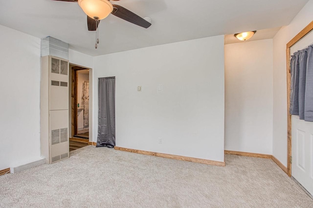 811 E Maple St, Lancaster, WI 53813 - unfurnished bedroom featuring carpet floors, baseboards, and a ceiling fan