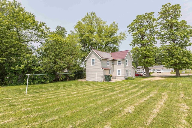 811 E Maple St, Lancaster, WI 53813 - view of property exterior featuring a lawn and metal roof