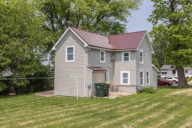 811 E Maple St, Lancaster, WI 53813 - rear view of property featuring a yard and metal roof