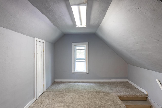 912 N Richmond St, Appleton, WI 54911 - bonus room with carpet flooring, vaulted ceiling, and baseboards