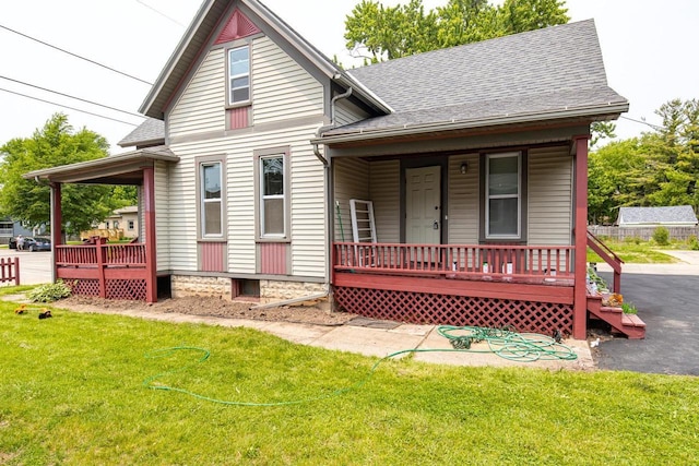 912 N Richmond St, Appleton, WI 54911 - bungalow-style house featuring covered porch, a front yard, and a shingled roof