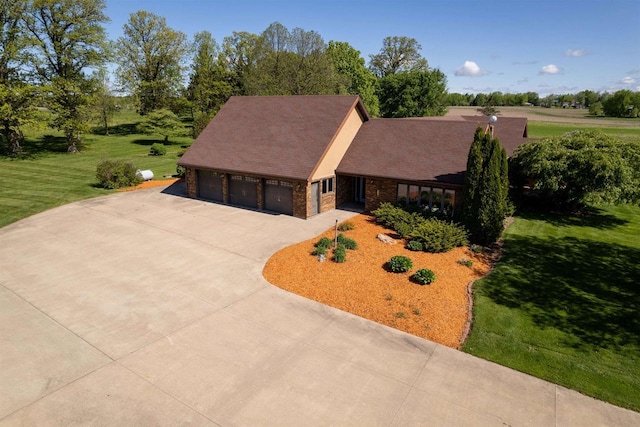 202602 County Road T, Marshfield, WI 54449 - view of front facade featuring driveway, a front lawn, and stone siding