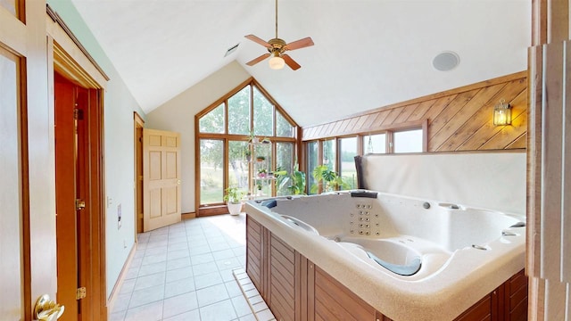 202602 County Road T, Marshfield, WI 54449 - bathroom featuring vaulted ceiling, healthy amount of natural light, a jetted tub, baseboards, and a ceiling fan