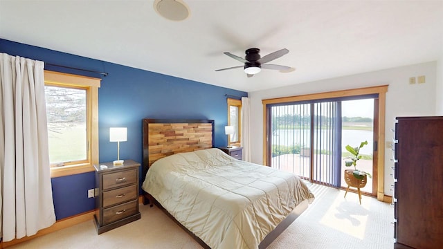 202602 County Road T, Marshfield, WI 54449 - bedroom featuring access to outside, light carpet, a water view, and ceiling fan