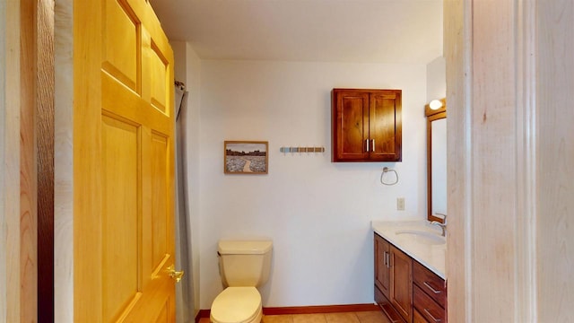 202602 County Road T, Marshfield, WI 54449 - bathroom featuring vanity, toilet, tile patterned flooring, and baseboards