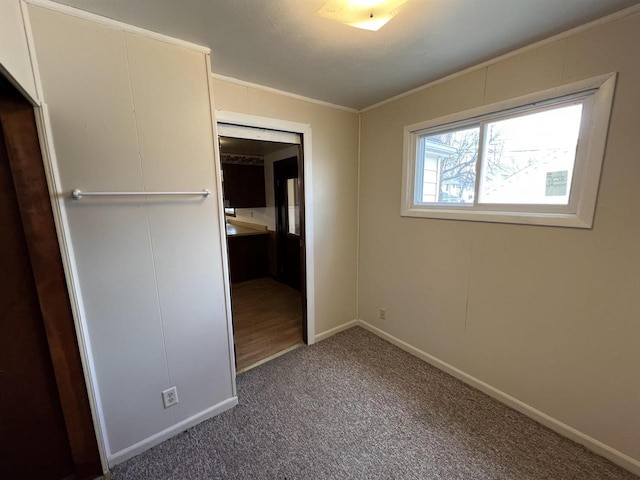 856 8th St, Beloit, WI 53511 - unfurnished bedroom featuring carpet floors, crown molding, and baseboards