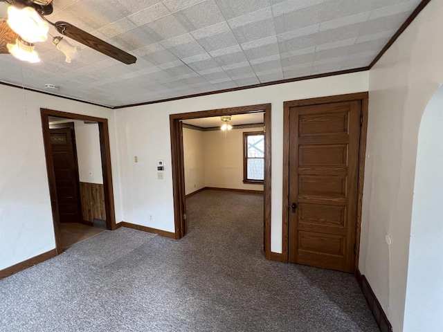 856 8th St, Beloit, WI 53511 - carpeted empty room with baseboards, a ceiling fan, and crown molding