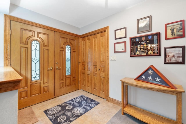 1001 W Fairfield Ct, Glendale, WI 53217 - foyer entrance with light tile patterned floors and baseboards