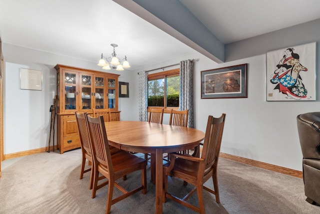 1001 W Fairfield Ct, Glendale, WI 53217 - dining space featuring a chandelier, light carpet, and baseboards