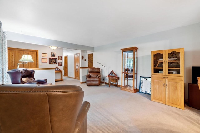 1001 W Fairfield Ct, Glendale, WI 53217 - living area with light carpet, plenty of natural light, and baseboards