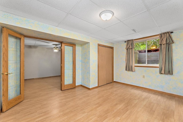 9432 James Ave, Sparta, WI 54656 - spare room with a paneled ceiling, light wood-type flooring, baseboards, and french doors