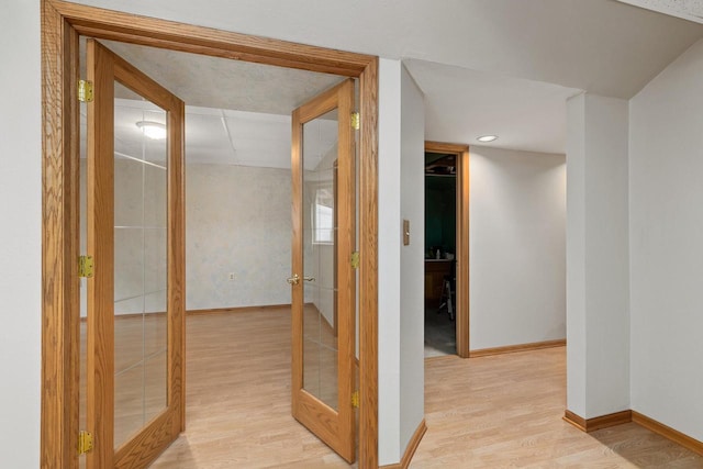 9432 James Ave, Sparta, WI 54656 - hallway with french doors, light wood finished floors, and baseboards