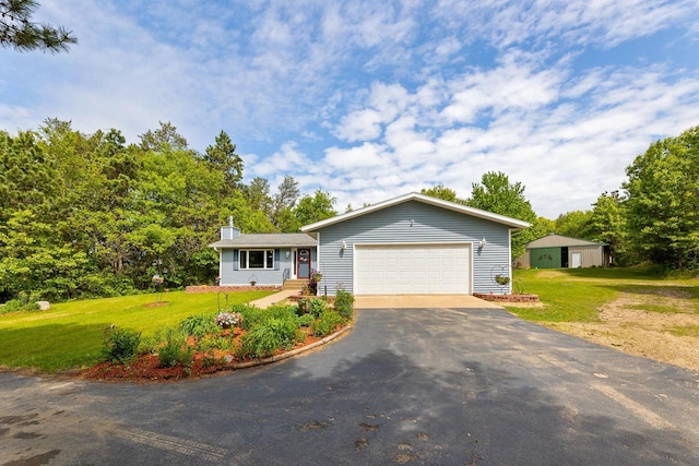 9432 James Ave, Sparta, WI 54656 - ranch-style home featuring driveway, a chimney, a front lawn, and a garage