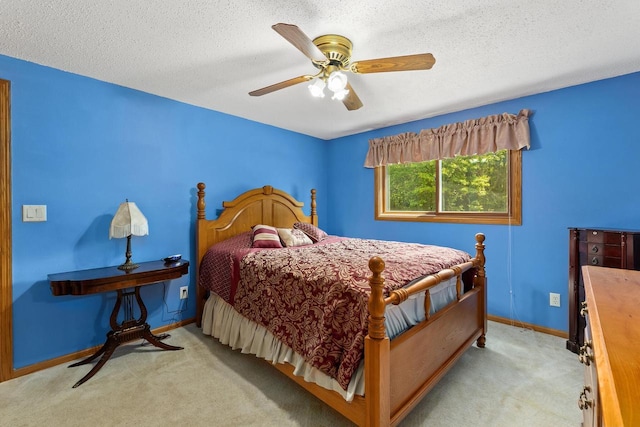 9432 James Ave, Sparta, WI 54656 - carpeted bedroom featuring baseboards, ceiling fan, and a textured ceiling