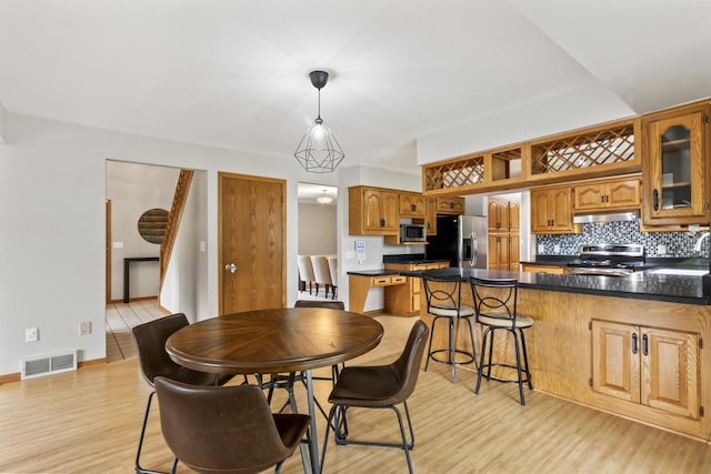 S38W32310 Green Briar Rd, Waukesha, WI 53189 - dining room featuring light wood-type flooring and baseboards