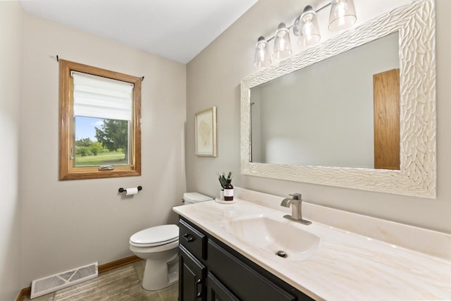 S38W32310 Green Briar Rd, Waukesha, WI 53189 - bathroom with toilet, vanity, and baseboards