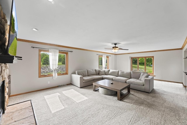 S38W32310 Green Briar Rd, Waukesha, WI 53189 - carpeted living area with baseboards, ornamental molding, a ceiling fan, and a stone fireplace
