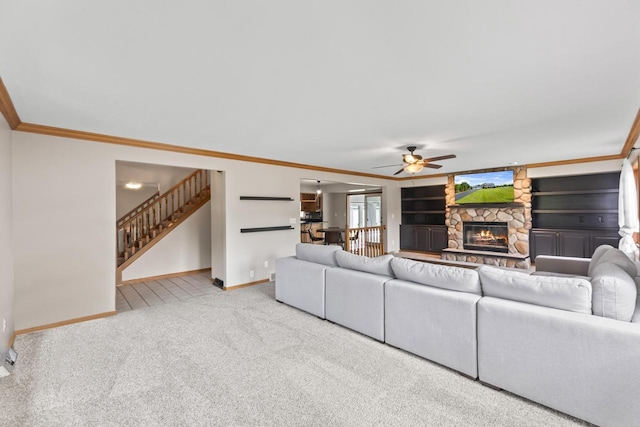 S38W32310 Green Briar Rd, Waukesha, WI 53189 - carpeted living room with ceiling fan, baseboards, stairs, a fireplace, and ornamental molding