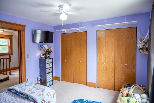 808 E State St, Mauston, WI 53948 - bedroom with two closets, carpet, ceiling fan, and baseboards