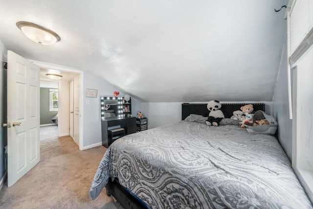 823 De Pere St, Menasha, WI 54952 - bedroom featuring light carpet, lofted ceiling, and baseboards