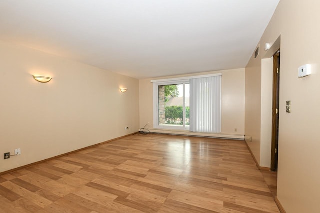 2260 W Good Hope Rd Unit 129, Glendale, WI 53209 - spare room with light wood-style floors and baseboards