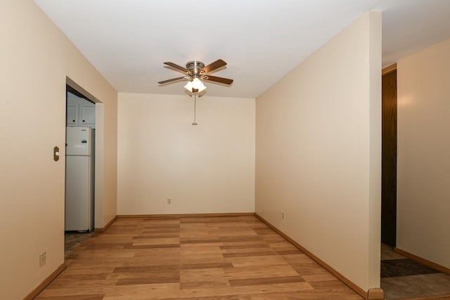 2260 W Good Hope Rd Unit 129, Glendale, WI 53209 - spare room with ceiling fan, light wood-style floors, and baseboards