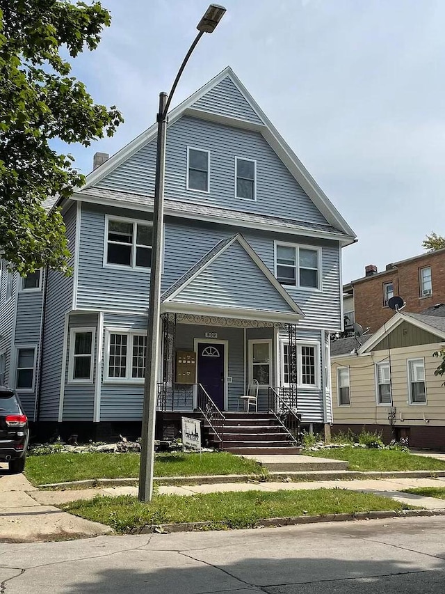 909 College Ave, Racine, WI 53403 - view of front of property featuring a porch
