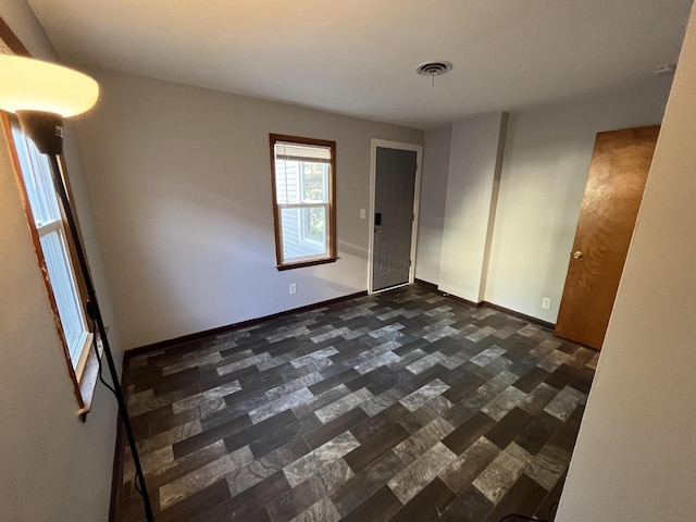 909 College Ave, Racine, WI 53403 - unfurnished room featuring baseboards