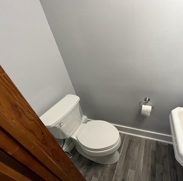 909 College Ave, Racine, WI 53403 - bathroom with wood finished floors and toilet
