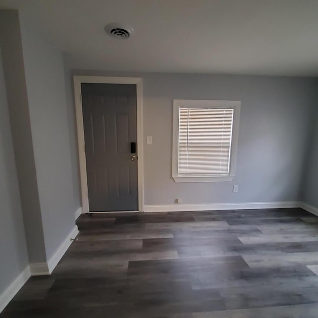 909 College Ave, Racine, WI 53403 - foyer entrance featuring wood finished floors